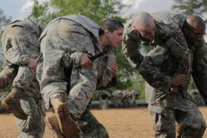 Then-Army 1st Lt. Kirsten Griest (C) and fellow soldiers participate in combatives training during the Ranger Course on Fort Benning, Ga., in April 2016.